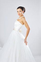 Young beautiful woman wearing luxurious wedding dress