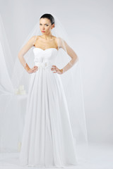 Fototapeta na wymiar Young beautiful woman wearing luxurious wedding dress