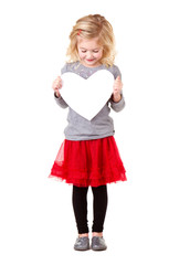 Little girl holding heart