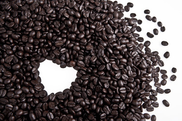 Coffee beans in heart shape isolated on white background
