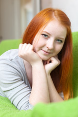  young girl relaxing on couch