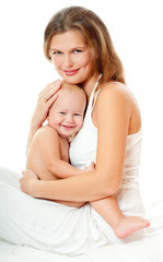 Young mother hugging baby