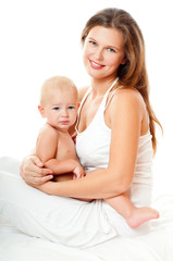 Young mother hugging baby