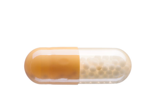 Yellow and White pill (capsule) macro shot, isolated