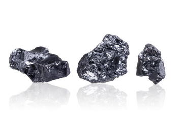 three pieces of a small Anthracite coal, isolated on white