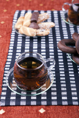Cup of tea with a plate of cookies