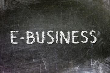 E-business handwritten with white chalk on a blackboard.