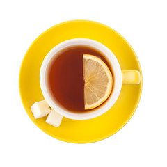 Yellow teacup with sugar and lemon