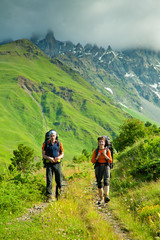 Fototapeta na wymiar Trekker in high mountains of Georgia Caucasus