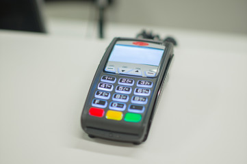 Credit card payment terminal on cash desk in mall