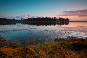 colorful sunset over peaceful lake