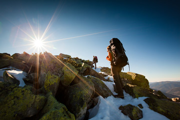 Hiker walking in autumn mountains