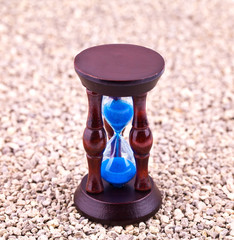 Hourglass on gravel