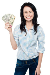 Attractive young woman holding money