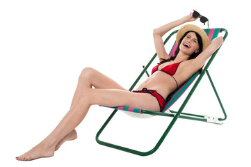 Full length portrait of relaxed cheerful bikini woman