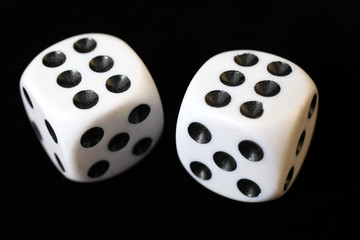 Two dices on a black background