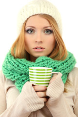Attractive young woman holding cup with hot drink, isolated