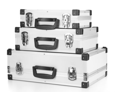 Silvery suitcases isolated on white