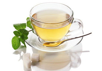 Cup of tea with mint isolated on white