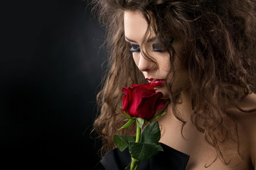 glamorous young woman with rose