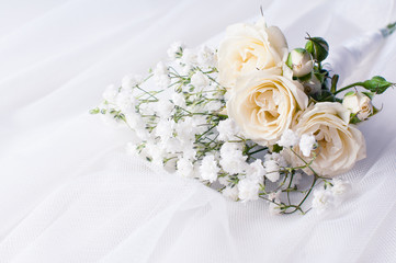 white roses on a white tulle