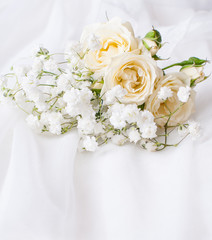 white roses on a white tulle