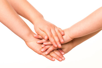 Two kids holding hands together.