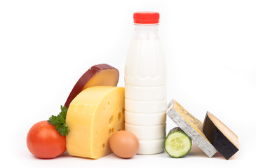 Various types of cheese and milk isolated on white