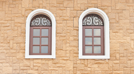 Fototapeta na wymiar Stone wall with windows