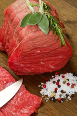 Raw beef on wooden table