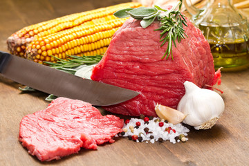 Raw beef on wooden table
