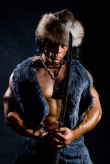 Male warrior with a sword in the form of a barbarian