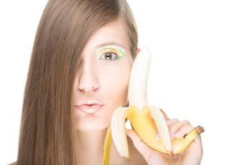 Pretty girl with banana isolated on white.