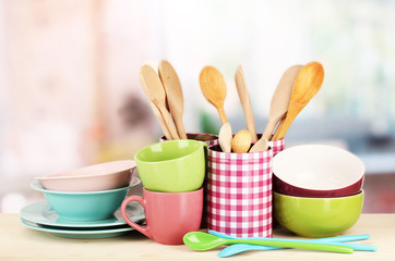 Cups, bowls nd other utensils in metal containers isolated