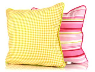 Yellow and pink bright pillows isolated on white