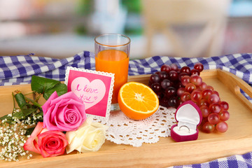 Breakfast in bed on Valentine's Day on room background