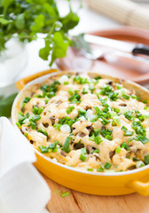 mushroom gratin with parmesan cheese in a pot for baking