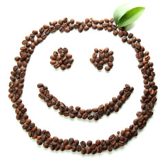 Coffee beans with leaves isolated on white
