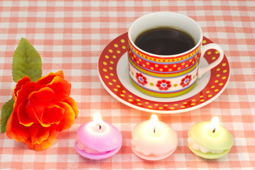 artificial rose and candles and coffee