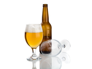 bottle of beer and glasses isolated on white