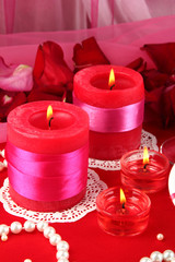 Decorated candles on celebratory table close-up