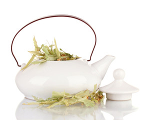 Dried herbs in teapot, isolated