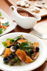 Salad with mushrooms, olives and chicken breast