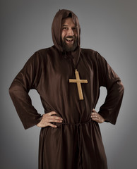 Monk in brown robe laughing