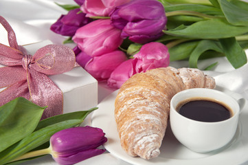 Breakfast, gift box and tulips on white silk