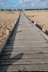 Wooden boardwalk on Dungeness beach, England