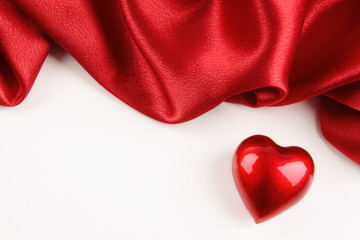 Valentine heart with red silk on off white background