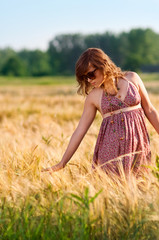 Fototapeta na wymiar Young woman in a meadow