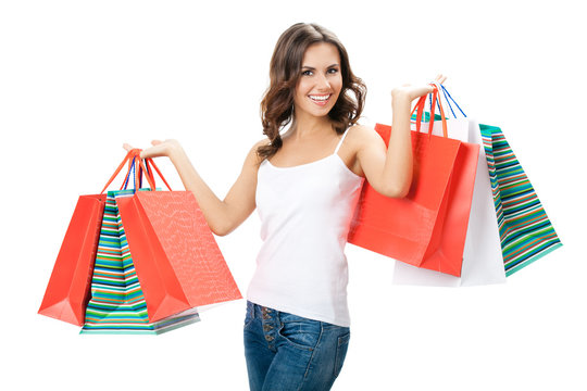 Young happy woman with shopping bags, isolated
