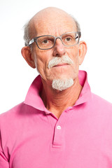 Serious well dressed senior man with glasses. Isolated.